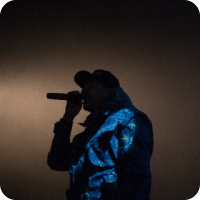 Live performer silhouette – artist performing over AI‑generated track