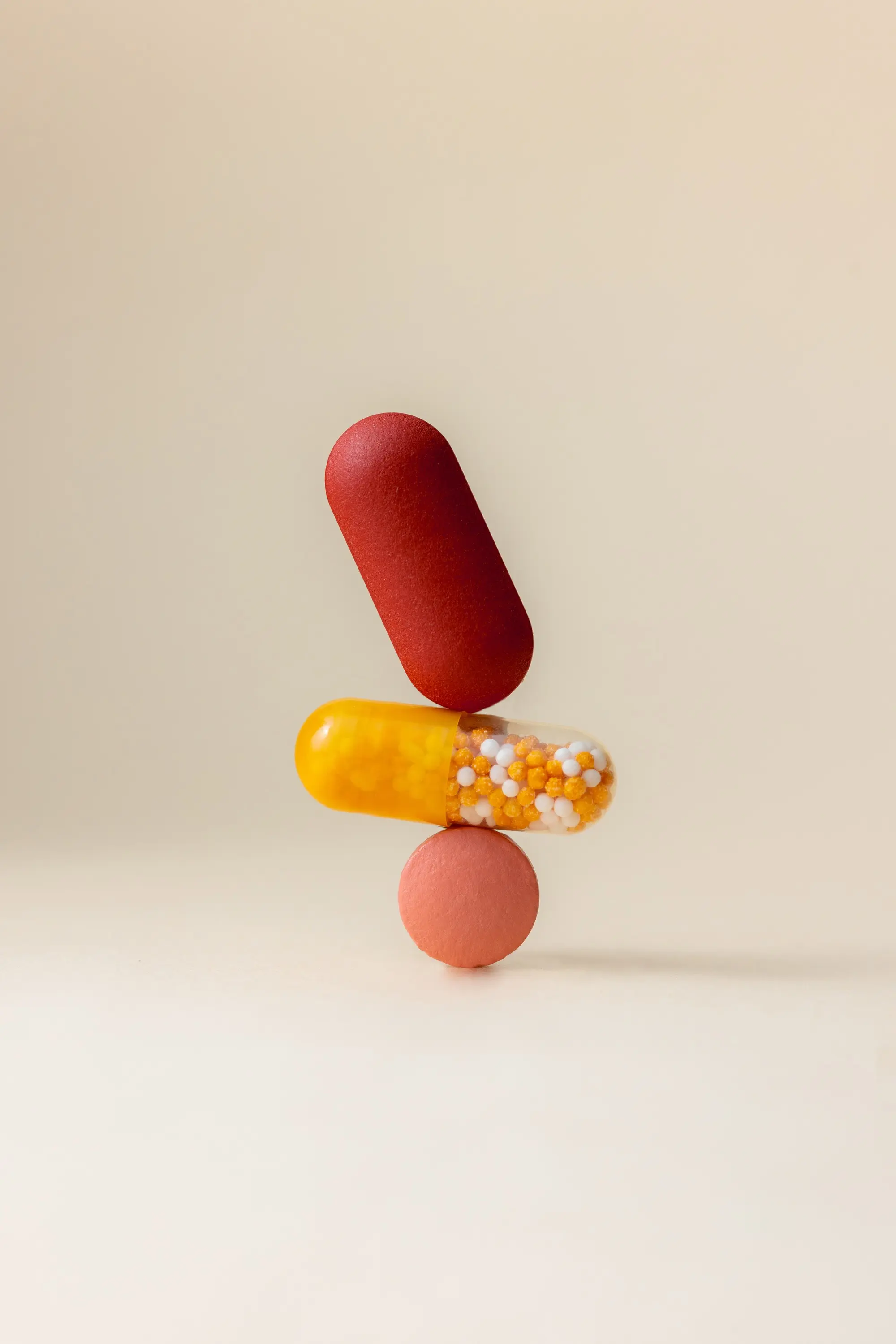 Minimalist stack of balanced medical pills and capsules